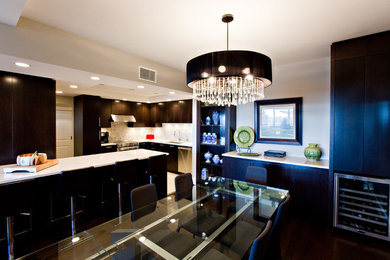 Mid-sized trendy dark wood floor kitchen/dining room combo photo in Other with gray walls