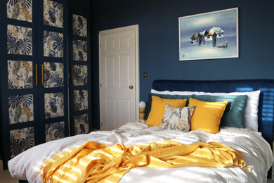 Example of a minimalist bedroom design in West Midlands