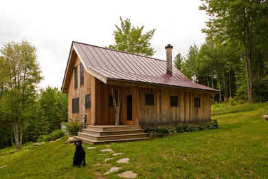 Small rustic two-story wood gable roof idea in Burlington