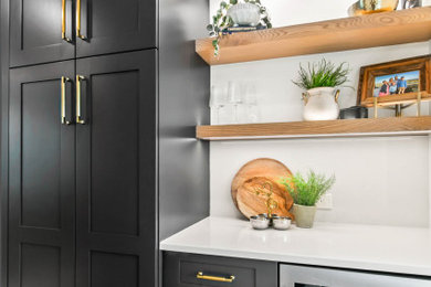 Inspiration for a transitional home bar remodel in Omaha