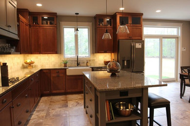 Mid-sized trendy l-shaped cement tile floor and multicolored floor open concept kitchen photo in Baltimore with a farmhouse sink, recessed-panel cabinets, dark wood cabinets, granite countertops, white backsplash, marble backsplash, stainless steel appliances and an island