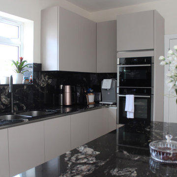 Elegant Modern Kitchen with Black Granite Island by Kudos Interior Designs