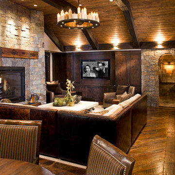 Reclaimed Wood Mantel on Stone Fireplace in Rustic Open Concept Living Room