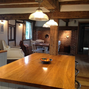 A charming, blue country kitchen installation with large island