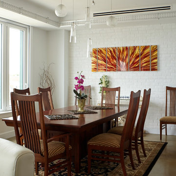 Custom track lighting accents the dining space