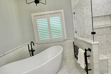 Inspiration for a transitional white tile ceramic tile freestanding bathtub remodel in Houston