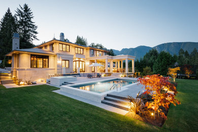 Example of a french country exterior home design in Vancouver