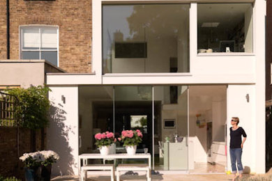 This is an example of a modern two floor semi-detached house in London with a flat roof.