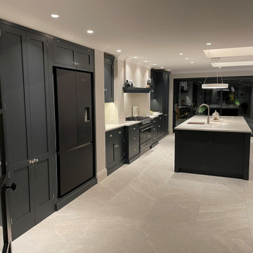 Modern monochrome handmade kitchen with full length larder