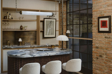 This is an example of a contemporary home bar in London.