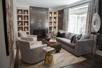 This is an example of a mid-sized transitional living room in Toronto with brown walls, a standard fireplace and a tile fireplace surround.