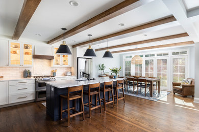 Example of a large transitional l-shaped dark wood floor open concept kitchen design in Detroit with white backsplash, an island and white countertops