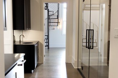 Wine cellar - transitional wine cellar idea in New Orleans