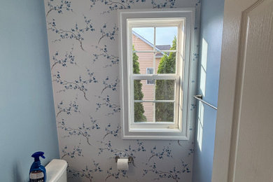 Transitional powder room photo in Other