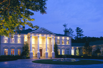 Huge elegant gray two-story stucco exterior home photo in Charleston