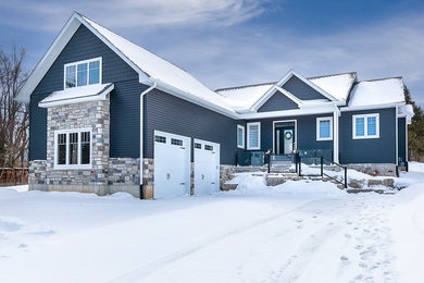 Inspiration for a coastal black vinyl exterior home remodel in Other
