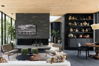 Living room - mid-sized 1960s open concept slate floor, black floor, wood ceiling and brick wall living room idea in Salt Lake City with black walls, a standard fireplace, a brick fireplace and a wall-mounted tv