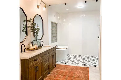 Small eclectic master double-sink tub/shower combo photo in Little Rock with furniture-like cabinets, dark wood cabinets, white countertops and a freestanding vanity
