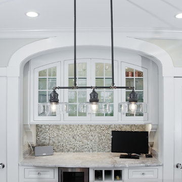 Custom Built-In Bar with Arched Cabinetry and Pendant Lighting – North Shore MA