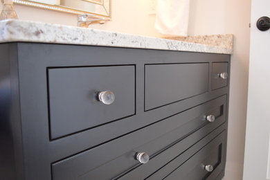Bathroom - mid-sized transitional 3/4 bathroom idea in Toronto with furniture-like cabinets, black cabinets, an undermount sink and granite countertops