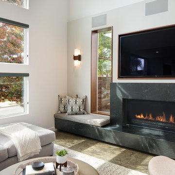Acuo LED Wall Sconce in Family Room - Oiled Walnut + Frosted Polymer