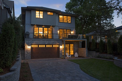 Large transitional gray two-story mixed siding house exterior photo in Minneapolis with a hip roof and a shingle roof