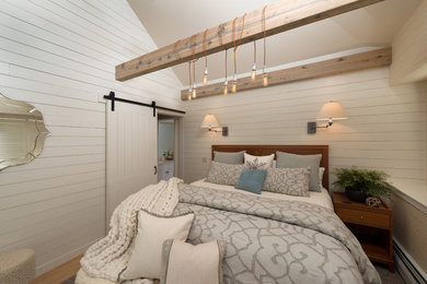 Example of a mid-sized cottage master light wood floor and beige floor bedroom design in Burlington with white walls