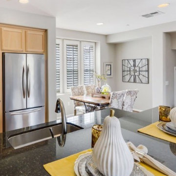 Modern accessories highlight the mood of the stainless steel appliances and dark