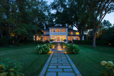Inspiration for a traditional partial sun stone water fountain landscape in Chicago.