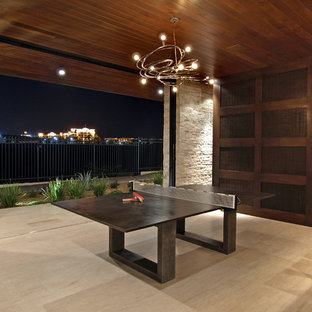 Inspiration for a medium sized contemporary open plan home cinema in Las Vegas with porcelain flooring and beige floors.