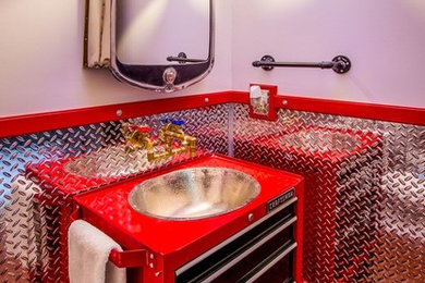Large eclectic 3/4 multicolored tile and metal tile bathroom photo in Other with furniture-like cabinets, black cabinets, red walls, a drop-in sink and solid surface countertops