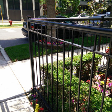 Lincoln Park fence metal refinishing, rust removal, priming and painting