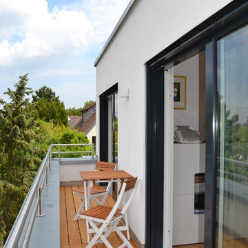 Flachdachhaus im Bauhausstil mit intergrierter Großraum-Garage