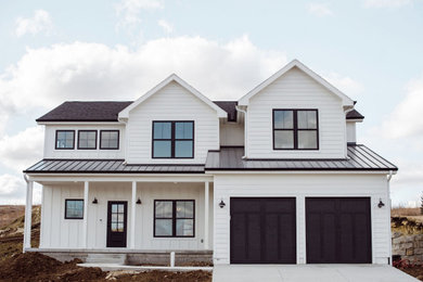 Example of a farmhouse exterior home design in Other