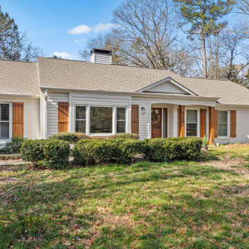 Full Front View of Ranch Home with Painted Brick and Wood Accents