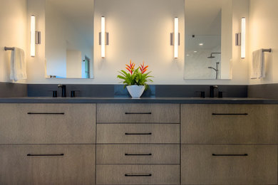 Large trendy master white tile and marble tile porcelain tile, brown floor and double-sink bathroom photo in San Francisco with flat-panel cabinets, medium tone wood cabinets, a one-piece toilet, white walls, an undermount sink, quartz countertops, gray countertops, a niche and a built-in vanity