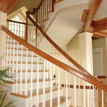 Custom Circular Switchback Staircase with Stained and Painted Wood Parts