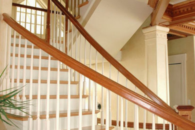 Inspiration for a large timeless wooden u-shaped wood railing staircase remodel in Chicago with painted risers