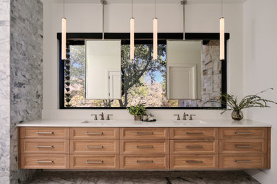 Bathroom - transitional black and white tile and marble tile marble floor and double-sink bathroom idea in Austin with light wood cabinets and white countertops