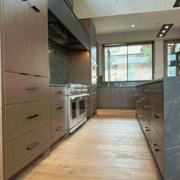 Galley Kitchen - Dark Stained Cabinets & Marble Island - Bend, OR