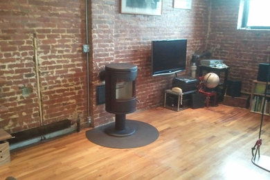 Living room - industrial living room idea in New York
