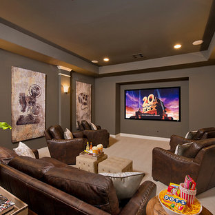 Inspiration for a timeless enclosed carpeted home theater remodel in Houston with brown walls and a wall-mounted tv