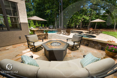 Patio - tropical patio idea in Charlotte