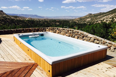 Pool - mid-sized southwestern rectangular lap pool idea in Indianapolis with decking