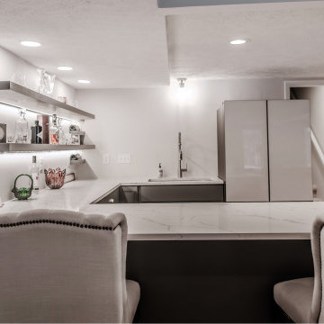 A Luxurious Basement Remodel with an Expanded Bar and Built-In Shelving
