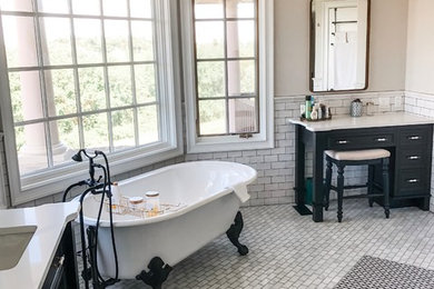 Inspiration for a mid-sized transitional master white tile and subway tile mosaic tile floor and white floor bathroom remodel in Philadelphia with recessed-panel cabinets, black cabinets, a two-piece toilet, beige walls, an undermount sink, quartz countertops and white countertops
