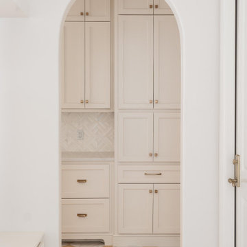 Architectural Elegance: The Arched Butler’s Pantry Entry