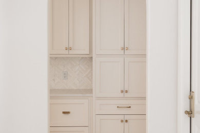 Inspiration for a french country marble floor and white floor hallway remodel in Oklahoma City with white walls