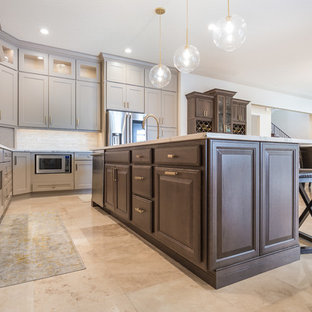 Mid-sized kitchen pantry ideas - Kitchen pantry - mid-sized l-shaped ceramic floor and multicolored floor kitchen pantry idea in Jacksonville with an undermount sink, recessed-panel cabinets, brown cabinets, quartz countertops, white backsplash, marble backsplash, stainless steel appliances, an island and white countertops