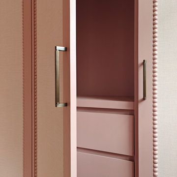 Antique Rose wardrobes with arched wallpapered panel doors and bobble beading.